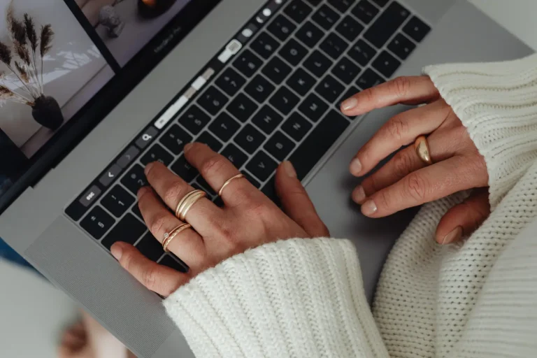 How To Optimize Your Blog Images For SEO In 5 Easy Steps 21 Woman using laptop to optimize blog post images for SEO.